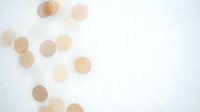 Soft beige and tan watercolor circles scattered on white textured paper background for artistic design projects and creative layouts.