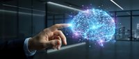Businessman hand touching glowing digital brain with neural network connections in modern office environment representing artificial intelligence technology.
