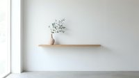 Wooden shelf with potted plant and dried greenery on white wall, minimalist interior design and home decor.