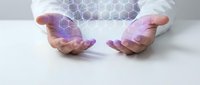 Hands protecting glowing hexagonal network structure representing data security, blockchain technology, and digital innovation in business environment.
