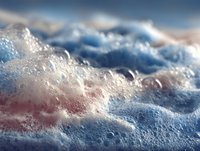 Colorful soap foam bubbles with iridescent surface creating abstract texture for cleaning and hygiene concepts in commercial advertising campaigns.