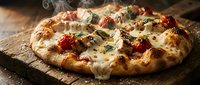 Freshly baked pizza with melted cheese, tomatoes, and herbs on wooden board, ready for serving or restaurant menu use.