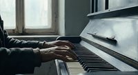 Musician hands playing piano keys in natural window light creating artistic shadows and peaceful atmosphere for music education and practice sessions.