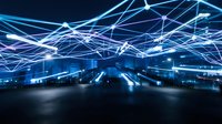 Futuristic digital network connections with glowing blue light trails over modern city skyline at night for technology and communication concepts.
