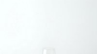 Transparent glass cup isolated on white background, ready for beverage mockups, product design, and commercial applications.