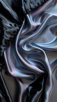 Luxurious black silk fabric with iridescent blue and pink reflections creating elegant flowing waves and folds against dark background. Suitable for luxury fashion designs.
