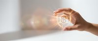 Hands protecting glowing house icon symbolizing home insurance, real estate protection, property security and residential safety concept with warm light.