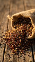Mixed peppercorns spilling from burlap sack on rustic wooden table. Colorful spices scattered across weathered wood surface for culinary and cooking projects.