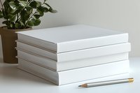Stack of white blank books with pencil and plant for creative writing, education, publishing, or office supplies mockup design projects.
