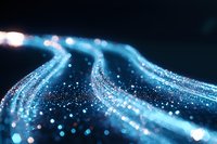 Glowing blue light trails with sparkling particles flowing in dark space create magical energy effect for technology and communication concepts.