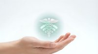 Young adult hand with open palm holding glowing medical caduceus symbol on white background, representing healthcare, medicine, wellness, and medical services for design use.