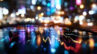 Blurred city lights reflecting on wet pavement at night creating colorful bokeh effect. Urban street scene with vibrant neon illumination for backgrounds.