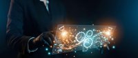 Businessman holding tablet displaying glowing digital brain network with artificial intelligence and data connections for technology innovation and smart computing solutions.