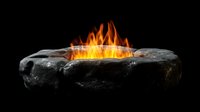 Glowing orange flames rising from dark stone fire pit against black background, dramatic lighting creates mystical atmosphere for outdoor entertainment space.