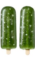 Green frozen popsicles with wooden sticks isolated on white background, showing frosty texture and ice crystals on surface. Refreshing summer treat.
