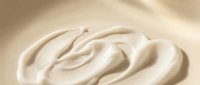 Creamy swirl of smooth beige cosmetic cream or lotion with elegant texture for skincare and beauty applications.