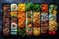 Diverse Asian fusion bento box with sushi rolls, grilled meat, rice, fresh vegetables, and french fries arranged in neat compartments on dark background.