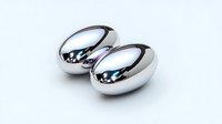 Two polished silver wedding rings on white background isolated for jewelry design and matrimonial concepts.