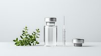 Medical glass vial with syringe and green plant on white background, minimalist pharmaceutical composition showing natural medicine concept.