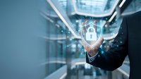 Businessman in dark suit touching glowing padlock icon with digital data streams in server room environment, representing cybersecurity and data protection technology.