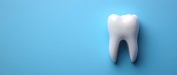 White tooth model isolated on blue background, suitable for dental care, orthodontics, and healthcare marketing materials.