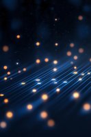 Abstract glowing orange particles floating over illuminated blue parallel lines creating futuristic technology concept background for digital transformation designs.