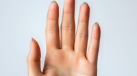 Open palm hand gesture showing five fingers against white background for communication and body language concepts in healthcare and wellness.