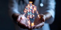 Glowing holographic human anatomy figure floating between hands shows skeletal and muscular systems with luminous energy effects against dark background.