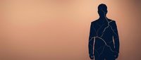 Silhouette of a man with glowing cracks across his body against warm sunset background, representing inner strength, resilience, and personal transformation for wellness and mental health concepts.