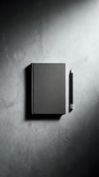Closed notebook with pen on textured concrete surface, minimalist flat lay composition for creative writing, journaling, and business branding projects.
