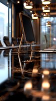 Empty modern conference room with blank black screen display stand on marble table, illuminated by warm pendant lights reflecting on polished surface.