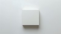 White blank square canvas mounted on light gray wall with soft shadow, minimalist art display mockup for gallery exhibition or home decor presentation.
