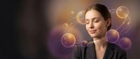Young woman with long dark hair and fair complexion wearing black blazer, eyes closed in contemplation, surrounded by glowing golden and purple spheres and bokeh light effects against blurred background.