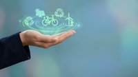 Businessperson holding glowing holographic icons of sustainable transport modes including bicycle, electric car, and bus for eco-friendly logistics solutions.