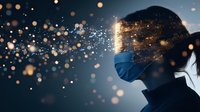 Medical professional in surgical mask with glowing light particles transforming face into golden sparkles against dark background, representing healthcare innovation.