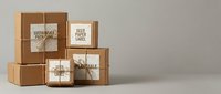 Kraft cardboard boxes with kraft paper labels and twine, arranged in a stack for shipping, packaging, and branding mockup purposes.