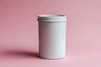 White cylindrical container with lid on soft pink background, minimalist product mockup for cosmetics, food, or storage solutions.
