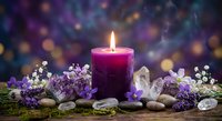 Purple candle burning surrounded by lavender flowers, crystals and smooth stones creating peaceful spa atmosphere for meditation and relaxation rituals.
