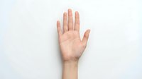 Open palm hand gesture showing five fingers against white background isolated for design and communication concepts.