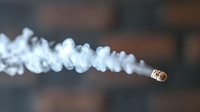 Burning cigarette with flowing smoke trail against dark background, captured in macro photography showing detailed smoke patterns and textures in soft focus.