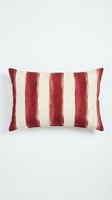 Burgundy and cream striped velvet lumbar pillow with vertical color blocking pattern, isolated on white background for home decor and interior design projects.