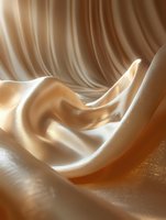 Luxurious flowing silk fabric in cream and beige tones creates elegant waves and folds with soft shadows and highlights, suitable for fashion and luxury product backgrounds.