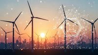 Wind turbines generating renewable energy at sunset with digital network connections representing smart grid technology and sustainable power solutions.