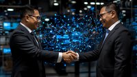 Asian businessmen handshaking with digital network visualization in background, symbolizing technology partnership and business collaboration in modern office.