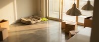Minimalist interior space with wooden furniture, pendant lamps, and natural light from windows. Empty room with concrete flooring, woven basket, and modern decor for home design projects.