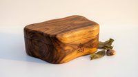 Handcrafted wooden storage box with rich grain patterns and natural wood finish, perfect for jewelry organization and home decor accessories.