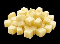 Diced raw potato cubes pile isolated on transparent background, ready for food design, clipart, stickers, print on demand, and T-shirt use.
