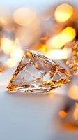 Crystal clear diamond shape with warm golden light reflections and bokeh effects on soft gray background, creating luxurious jewelry atmosphere.