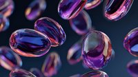 Colorful iridescent liquid droplets or glass beads with purple and pink reflections floating against dark background, creating abstract macro art.