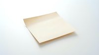 Blank beige adhesive note pad isolated on white background, ready for design mockups, branding presentations, and stationery templates.
